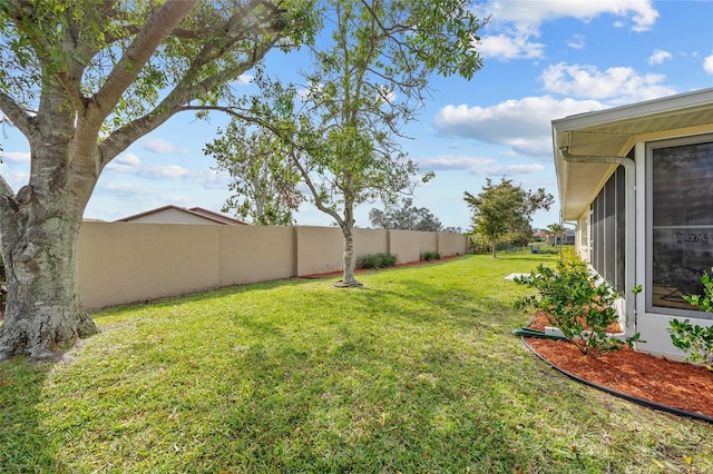 view of yard with a fenced backyard