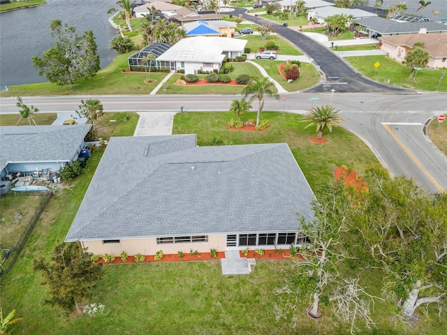 bird's eye view with a water view and a residential view