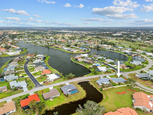 aerial view with a water view and a residential view