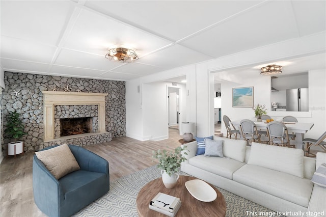 23475 Harper Ave, Port Charlotte, FL 33980 - living room featuring wood finished floors, a fireplace, and baseboards