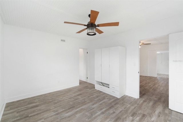 23475 Harper Ave, Port Charlotte, FL 33980 - unfurnished room featuring ceiling fan, light wood-style floors, and baseboards