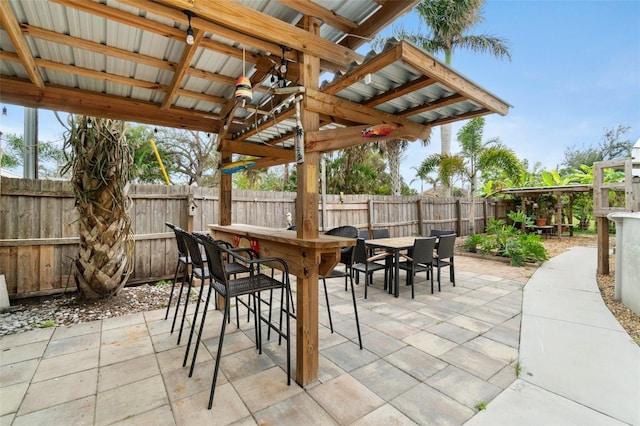 23475 Harper Ave, Port Charlotte, FL 33980 - fenced backyard with a patio area and outdoor dining area