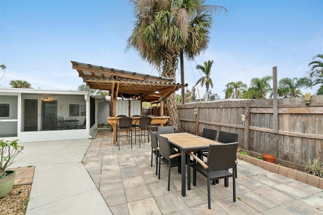 23475 Harper Ave, Port Charlotte, FL 33980 - fenced backyard featuring outdoor dining area, a patio, and a pergola