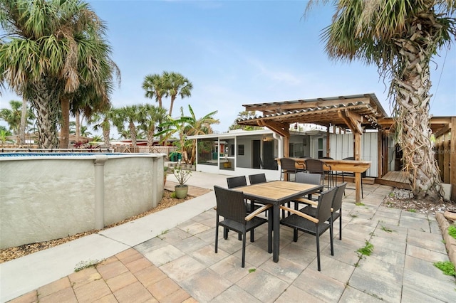 23475 Harper Ave, Port Charlotte, FL 33980 - view of patio / terrace with outdoor dining space, an outdoor pool, and a pergola