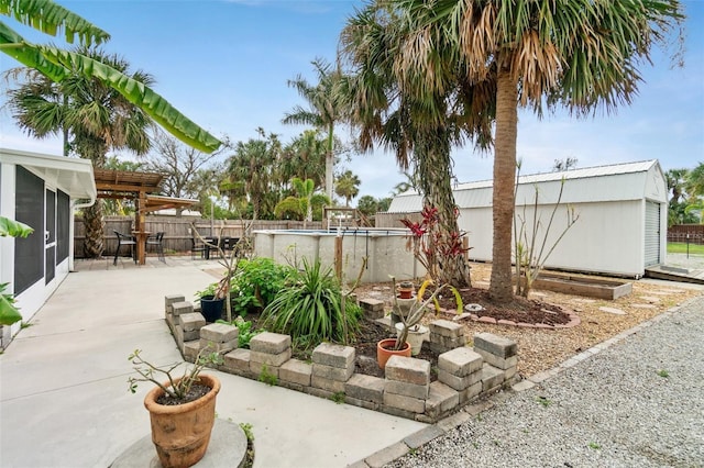 23475 Harper Ave, Port Charlotte, FL 33980 - fenced backyard featuring a patio and an outbuilding