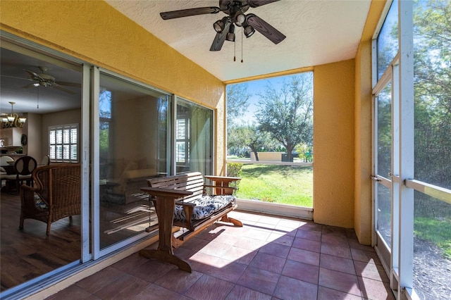 sunroom with a ceiling fan