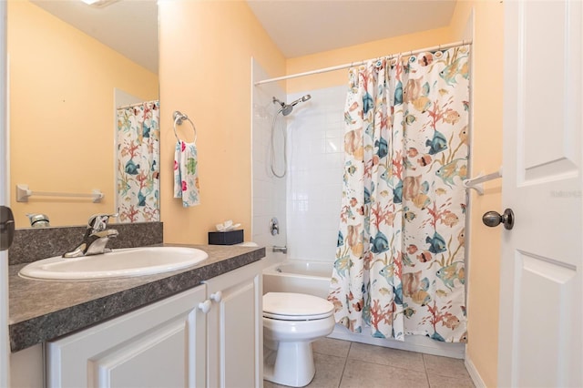 full bathroom featuring toilet, vanity, and tile patterned floors