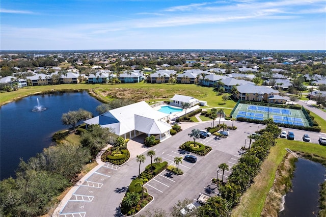 birds eye view of property featuring a residential view and a water view