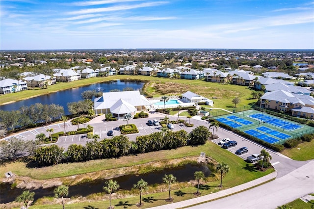 bird's eye view featuring a residential view and a water view