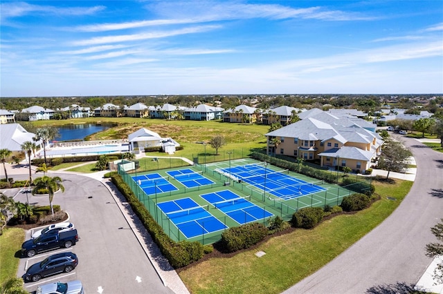 bird's eye view with a water view and a residential view