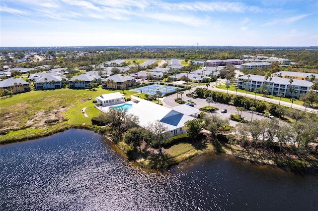 birds eye view of property with a residential view and a water view