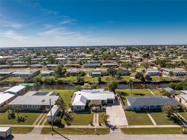 bird's eye view featuring a residential view and a water view