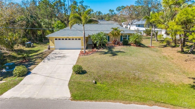 view of front of house featuring a front yard and a garage