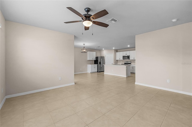 unfurnished living room with recessed lighting, baseboards, visible vents, and ceiling fan with notable chandelier