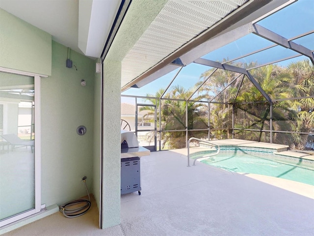 outdoor pool featuring a lanai and a patio area