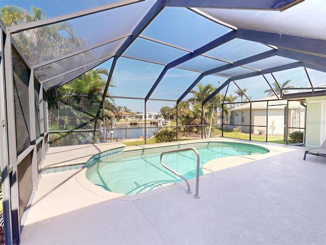 outdoor pool featuring a patio, a water view, and glass enclosure