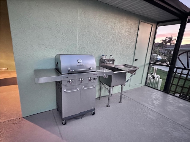 patio terrace at dusk with grilling area