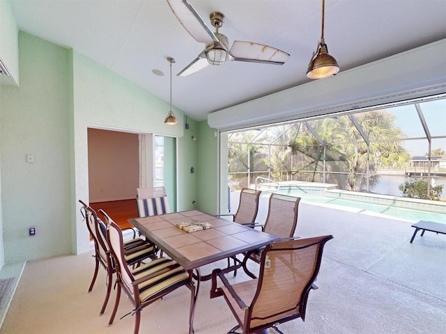 dining space with a sunroom, vaulted ceiling, and ceiling fan