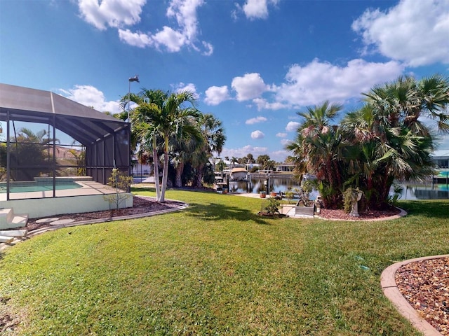 view of yard featuring a lanai and an outdoor pool