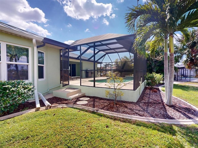 exterior space featuring glass enclosure, an outdoor pool, and a patio