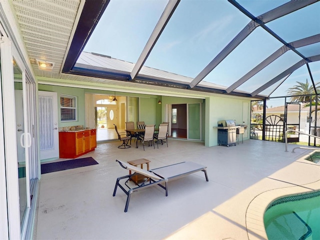 exterior space with vaulted ceiling with skylight