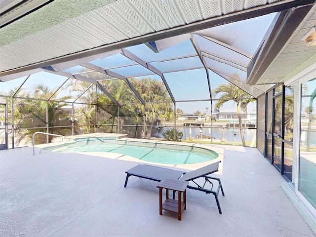 pool featuring a water view, glass enclosure, and a patio