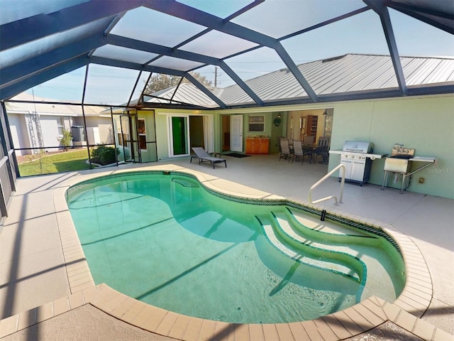 pool with a lanai and a patio area