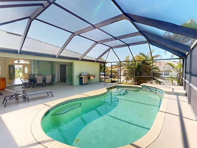 pool featuring a lanai, outdoor dining area, and a patio