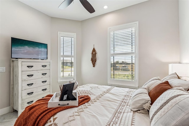 bedroom with ceiling fan, multiple windows, baseboards, and recessed lighting