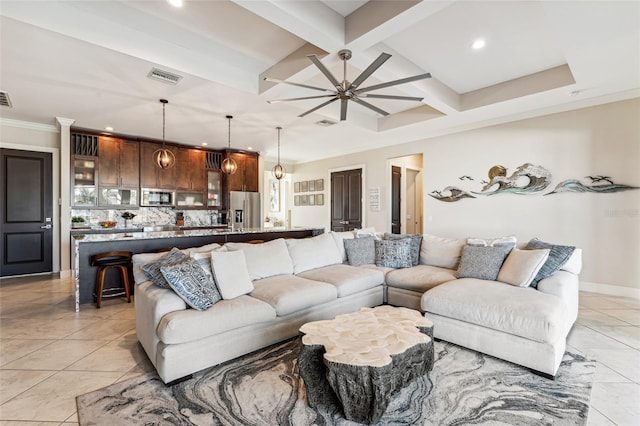 living area with coffered ceiling, visible vents, ceiling fan, and beamed ceiling