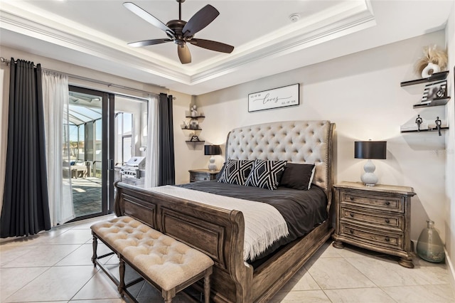 bedroom with light tile patterned floors, ornamental molding, a raised ceiling, and access to exterior