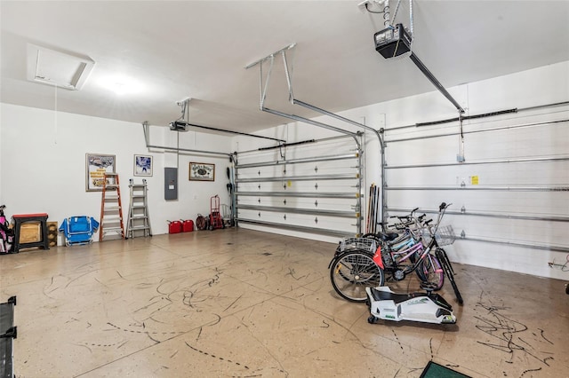 garage featuring electric panel and a garage door opener