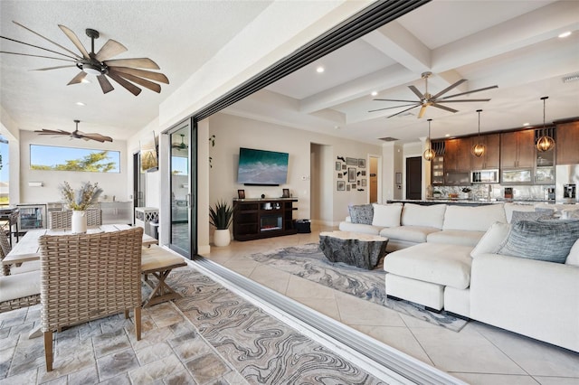 living room with baseboards, visible vents, ceiling fan, beamed ceiling, and recessed lighting