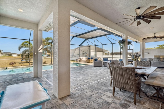 view of patio featuring an outdoor pool, ceiling fan, area for grilling, and an outdoor hangout area