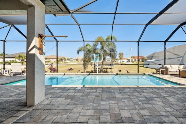 outdoor pool featuring a patio area, a lanai, and an outdoor living space