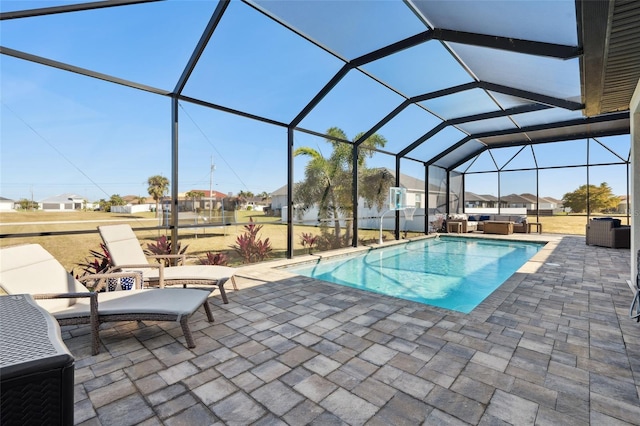 pool featuring a residential view, a lanai, a patio area, and a jacuzzi