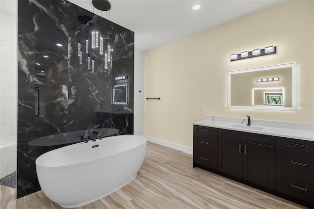 bathroom with tile walls, vanity, and a washtub