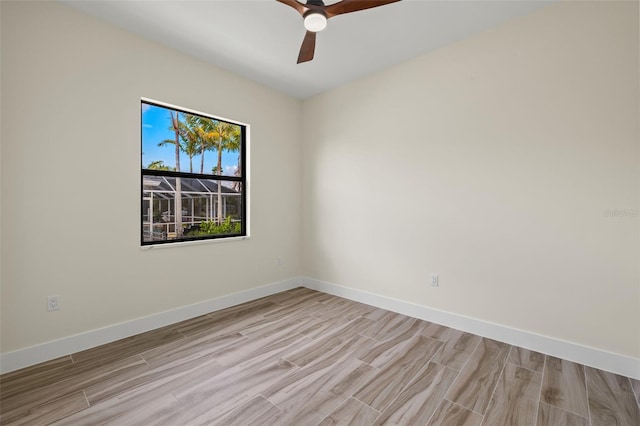 empty room featuring ceiling fan and light hardwood / wood-style flooring