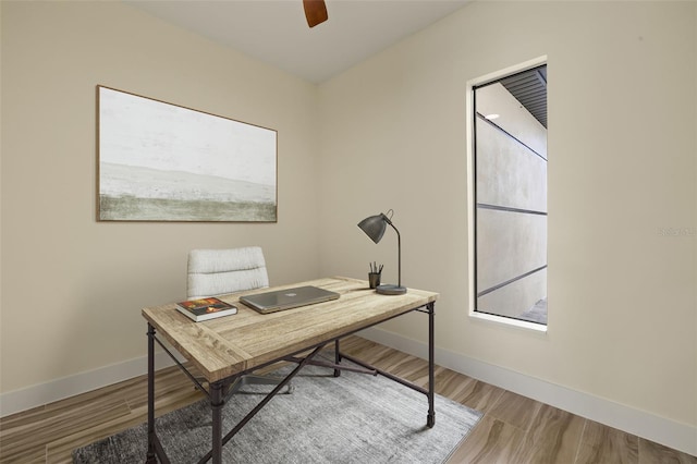 office area with ceiling fan and wood-type flooring