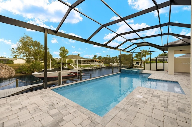 view of swimming pool featuring a water view, a lanai, an in ground hot tub, a patio, and a dock