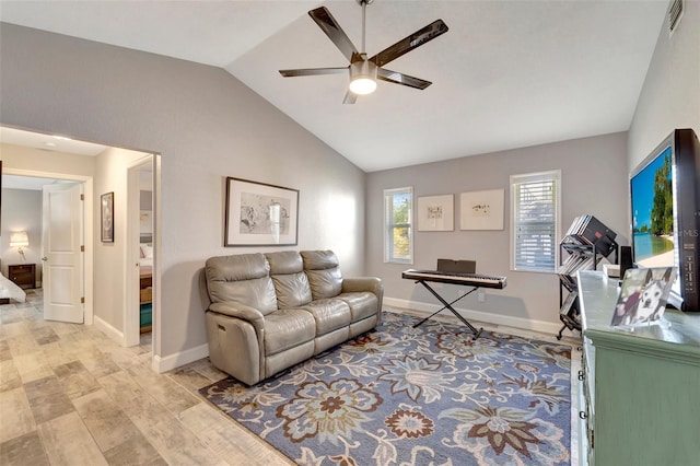 interior space featuring ceiling fan, vaulted ceiling, and light hardwood / wood-style flooring