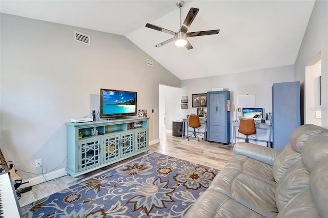 living room featuring light hardwood / wood-style flooring, ceiling fan, and vaulted ceiling