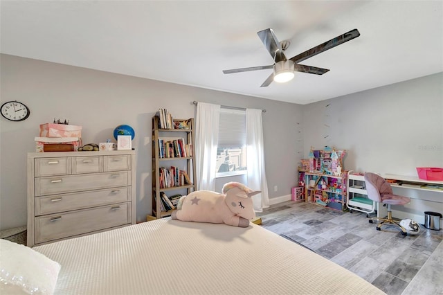 bedroom featuring light hardwood / wood-style flooring and ceiling fan