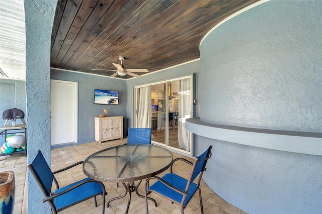 view of patio featuring ceiling fan