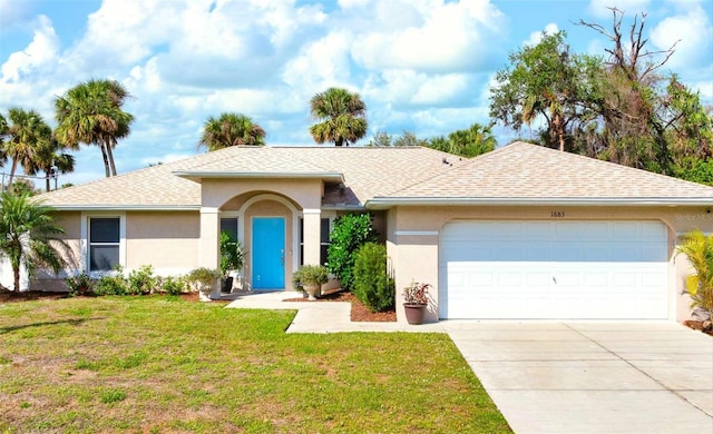 single story home featuring a garage, a front yard, and stucco siding