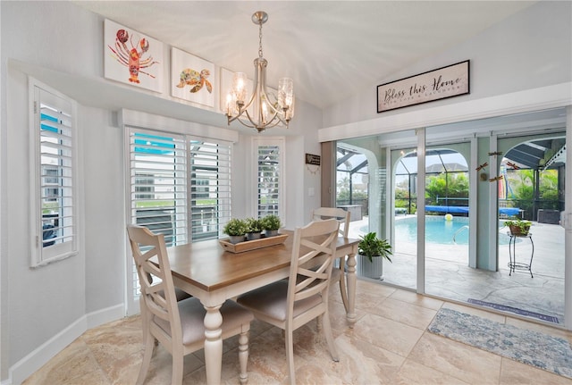 dining room featuring lofted ceiling, a sunroom, and baseboards