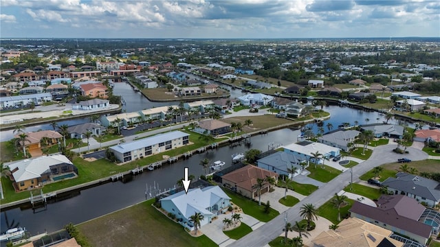 aerial view with a residential view and a water view