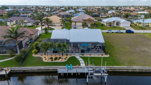 aerial view with a water view and a residential view