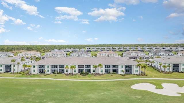 view of front of home with a front lawn and a residential view