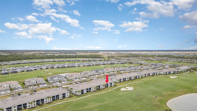 birds eye view of property with a residential view and view of golf course